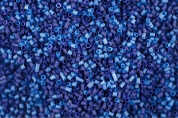 Close up Flat lay of a blue plastic polypropylene granules on a table, copy space, Generative AI