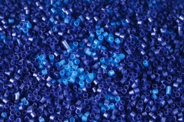 Close up Flat lay of a blue plastic polypropylene granules on a table, copy space, Generative AI - obrazy, fototapety, plakaty