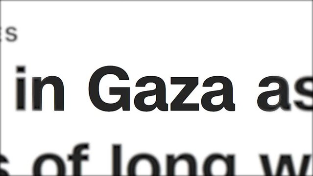 Mention of Gaza in the headlines of electronic information media. Highlighted fast changing iridescent letters close up. Breaking news about the military conflict between Israel and Palestine
