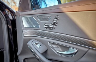 Modern city car black leather door,  inside luxury city car photo