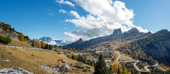 Veneto, Italy - Passo Falzarego in autumn located in the Ampezzo Dolomites - 671510554