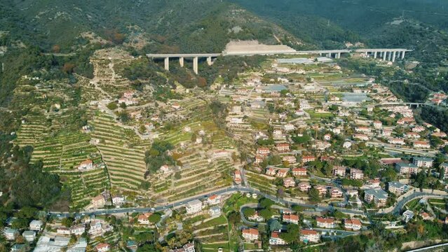 Epic aerial drone shot view of Ospedaletti a beautiful town on the ligurian riviera near San Remo in Italy. 