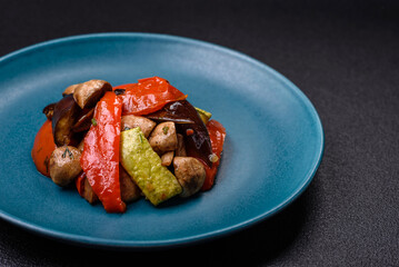 Delicious salad of grilled vegetables tomatoes, mushrooms, sweet peppers, eggplants