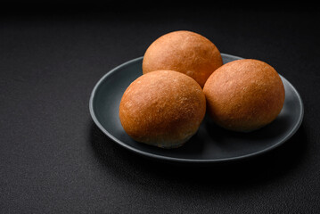 Delicious fresh crispy white round bread with seeds and grains