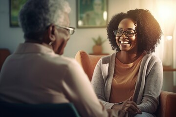 A happy elder talking to their homecare provider about their needs. Healthcare worker or caregiver visiting senior woman indoors at home. Caregiver or healthcare worker visiting senior woman - obrazy, fototapety, plakaty