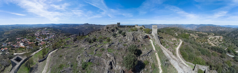 Fototapeta na wymiar Aerial exterior view at the iconic Numão Castle, ruins Castle on top at the mountains, an heritage medieval architecture structure, Numão village downtown, Portugal