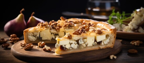 Selective focus on a homemade open pie with goat cheese pears nuts and grape jam from Alsace