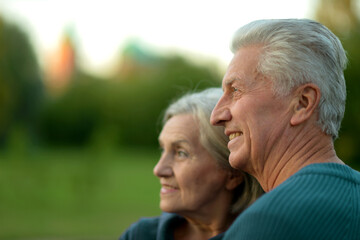Fototapeta premium Elderly couple dance in the park in autumn.