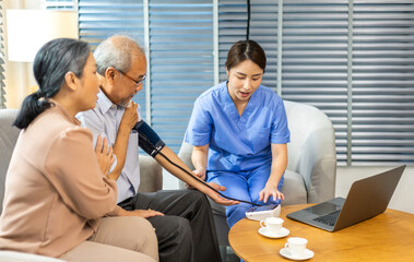 Portrait of smiling caring asian nurse service help support discussing and consulting taking care with senior elderly asian man and woman couple at home visit.senior retirement home care concept