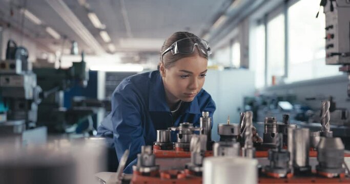 Confident trainee inspects drill inserts