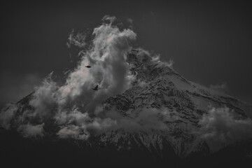 black and white clouds around Mount Chaberton