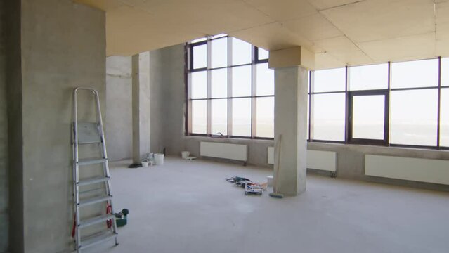 Construction worker with tablet coming to workplace