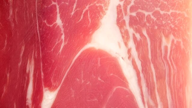 Jamon Serrano or Iberico macro, slider shot. Spanish ham pork for tapas
