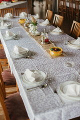 Flower decoration for celebrations. Decoration of tables and chairs. Rustic decoration.