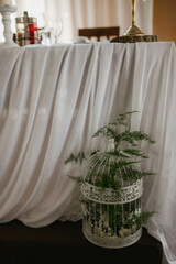 Flower decoration for celebrations. Decoration of tables and chairs. Rustic decoration.