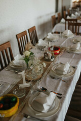 Flower decoration for celebrations. Decoration of tables and chairs. Rustic decoration.