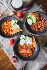 Hot plate or Sambal Gami is Traditional food from Indonesia. Served on plate with a bowl of rice and vegetables top view. Super hot and spicy food