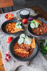 Hot plate or Sambal Gami is Traditional food from Indonesia. Served on plate with a bowl of rice and vegetables top view. Super hot and spicy food