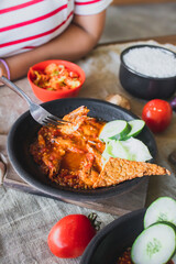 Hot plate or Sambal Gami is Traditional food from Indonesia. Served on plate with a bowl of rice and vegetables top view. Super hot and spicy food