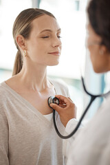Checking and hearing heart rate with a working doctor consulting the wellness and health of a...