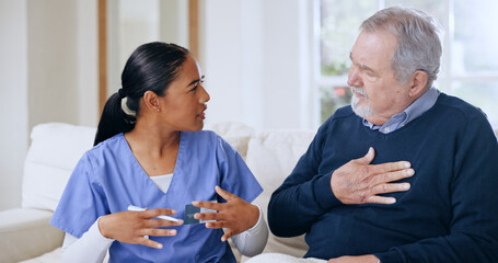 Obraz premium Nurse, communication and elderly man with chest pain, lunge cancer or sick from heart infection, virus or tuberculosis. Caregiver consultation, healthcare support and client explain breathing problem