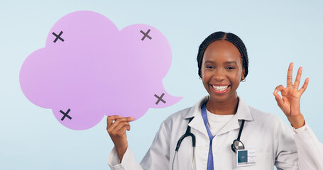 Happy black woman, doctor and OK sign with speech bubble for social media review against a studio...