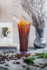 Portrait of a glass of dark stout or porter beer with coffee added. Wooden background