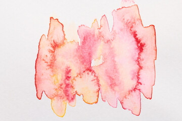 Abstract red background. Paint stains on paper, bright backdrop