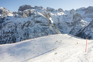 Winter view on dolomites alps in Italy.  Pinzolo in winter sunny day. Val Rendena dolomites ...