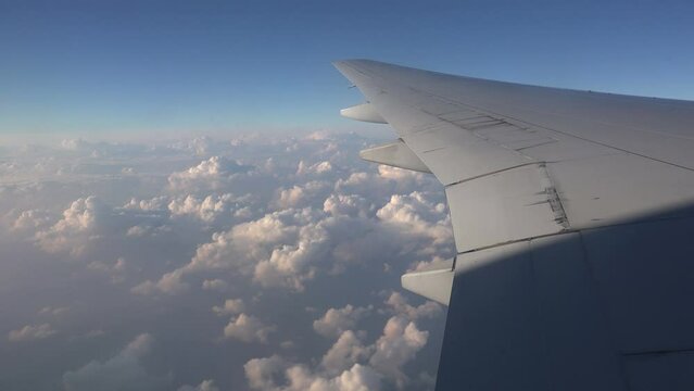 Flying Over Storm Clouds In The Middle East, On A Flight From Doha To Dubai, Looking Out Plane Window Towards Wings 