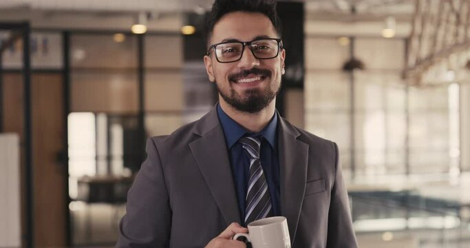 Businessman smiles at the camera