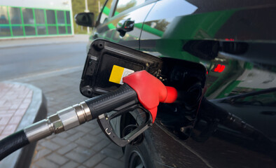 Refueling cars at pump fuel station. Fump dispenser at petrol station. Fuel price, diesel, gas...