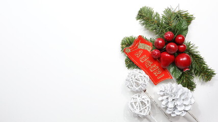 Christmas decorations with happy birthday written, close-up on a shiny black background