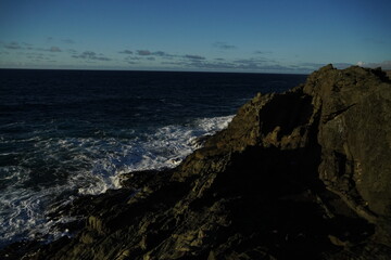 effects of waves and the ocean on the coast at sunset