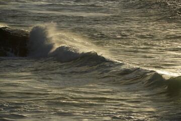 effects of waves and the ocean on the coast at sunset