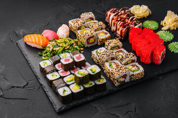 Sushi set on black stone background