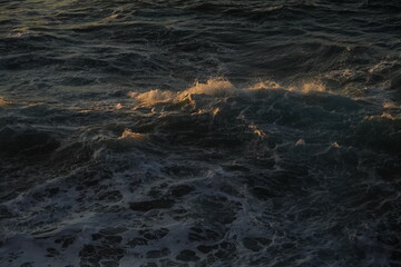 effects of waves and the ocean on the coast at sunset