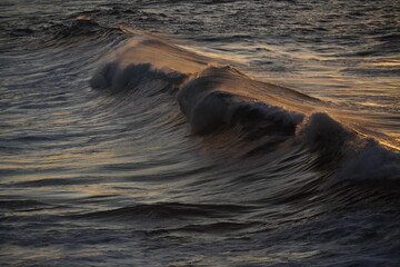 sea waves crashing against rocks