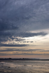 Naklejka na ściany i meble Clouds at Sunset at Paesens. Moddergat. Friesland Netherlands. Waddenzee. Coast 
