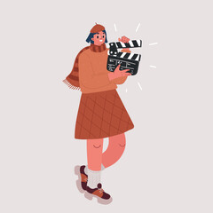 Cheerful smiling fun african american young woman 20s wears green shirt holding classic black film making clapperboard isolated on yellow background studio portrait. People emotions lifestyle concept.