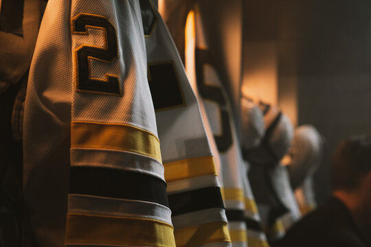 ECU View of ice hockey team uniform hanging in a changing room