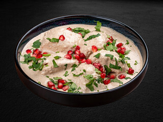 Chakhokhbili is a traditional dish of Caucasian cuisine, a stew of poultry stewed with vegetables, herbs and spices. Isolated on a dark background