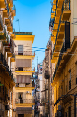 Colorful facades in a narrow street in old town “Centro storico“ of historic italian metropole...