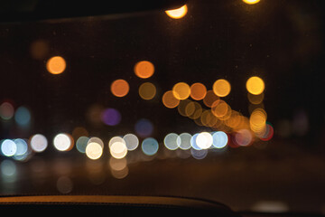 Car windshield view on New York night highway with cars and street lamps. Abstract stylish urban...