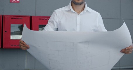 Entrepreneur holds blueprint of building apartment. Remote worker manager waits for meetup with colleagues from estate agency