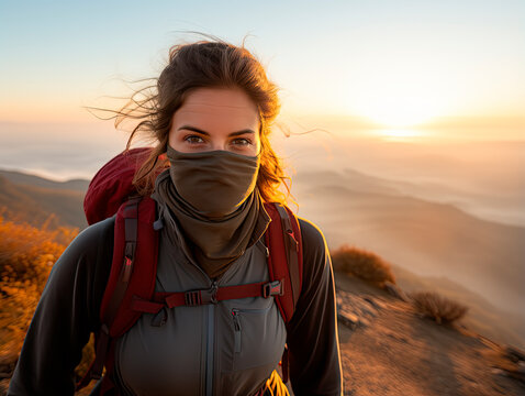 a young hiker wearing a breathable hiking face mask on a mountain trail