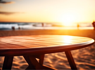 close up of a wooden table surface lookin into the beach at sunset. 

