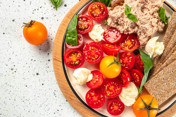 Caprese salad with Liver pate, rye crackers, healthy foods. banner, menu, recipe place for text, top view