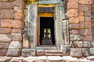 Fototapeta na wymiar The statue is in Phimai Prasat Hin Historical Park, located in Phimai District. Nakhon Ratchasima Province During the Khmer Empire, it was large and beautiful. Built in the reign of King Suryavarman I