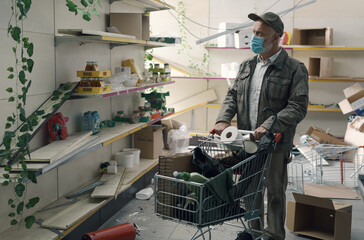 Man doing grocery shopping in a destroyed supermarket interior